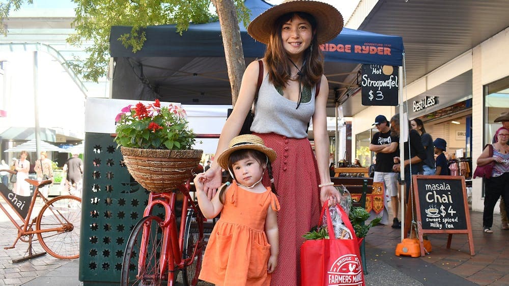 Woman and girl at Farmers Market Day at the Bridge Mall