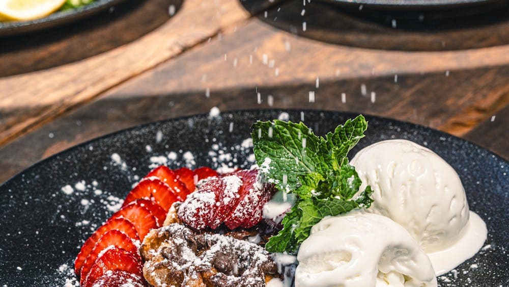 Image of waffles with ice cream, nutella and strawberries