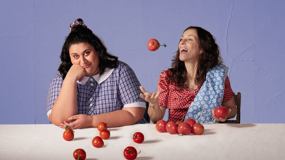 Mother and Daughter making passata