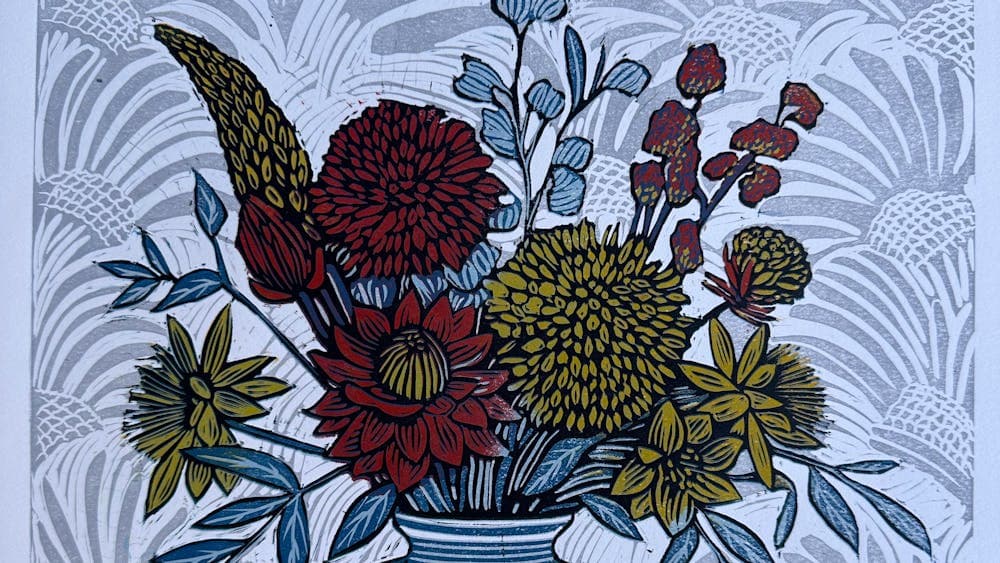 Bouquet of flowers in a blue vase.