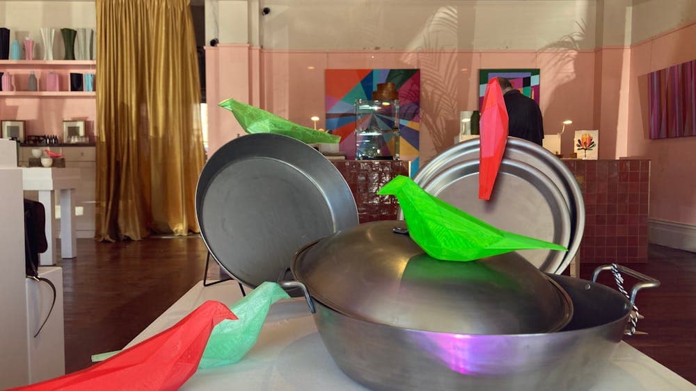 metal cookware and 3D printed birds on display