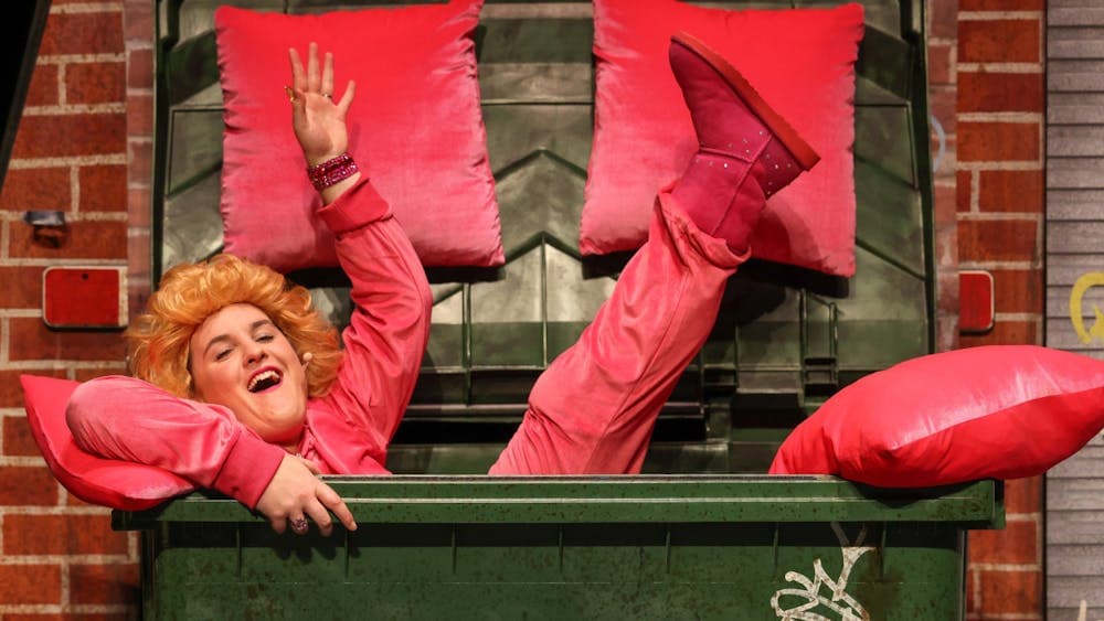 Yep, that's a woman in a dumpster alright.