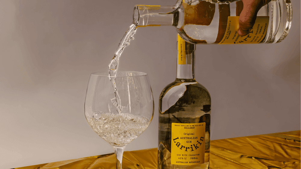 Gin being poured from the bottle into a glass