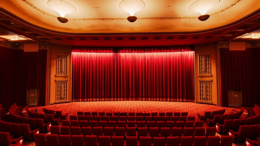 Inside of a cinema facing the curtains