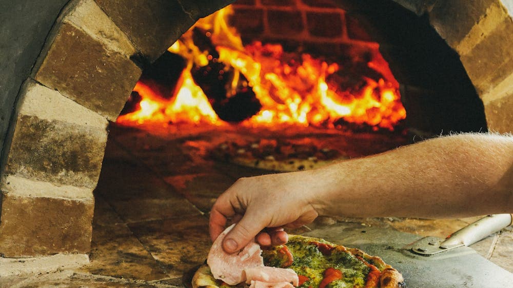 Pizza cooking in oven