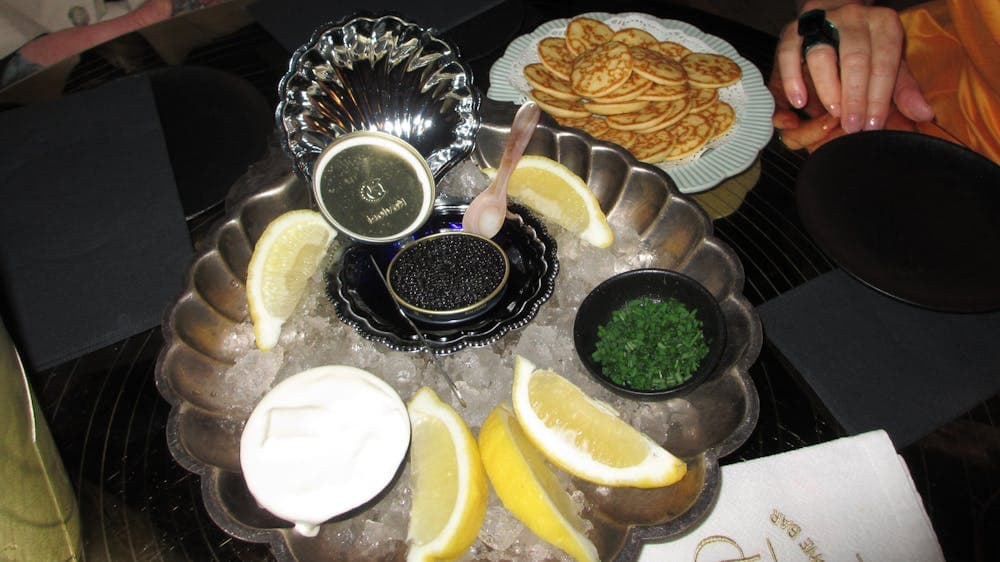 Plate of caviar on table