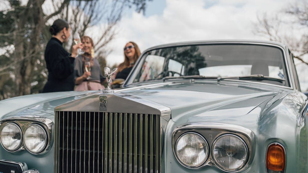 Women enjoying a chauffeured day out in "Minx" the vintage Rolls Royce