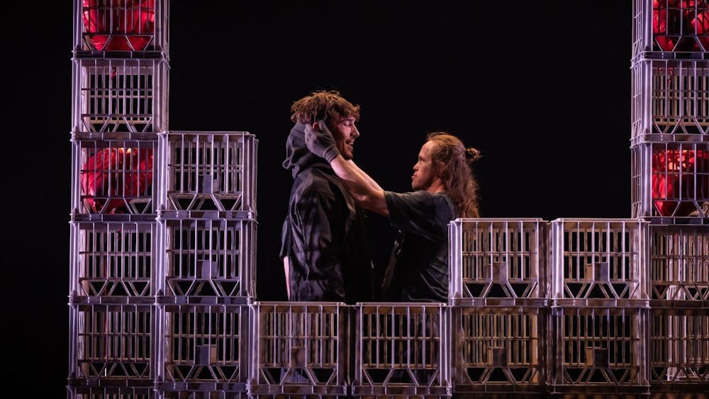 Chris Dyke and Dancer amidst a city built from milk crates