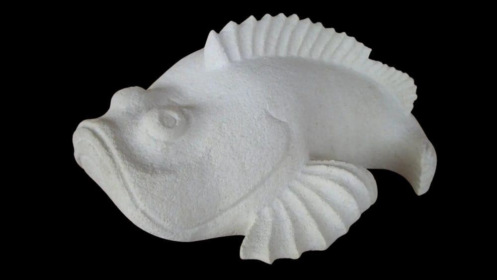 White limestone carved fish