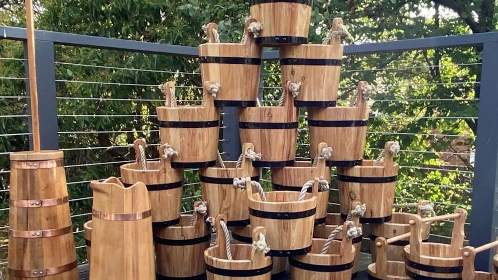 Wooden buckets stacked on top of one another
