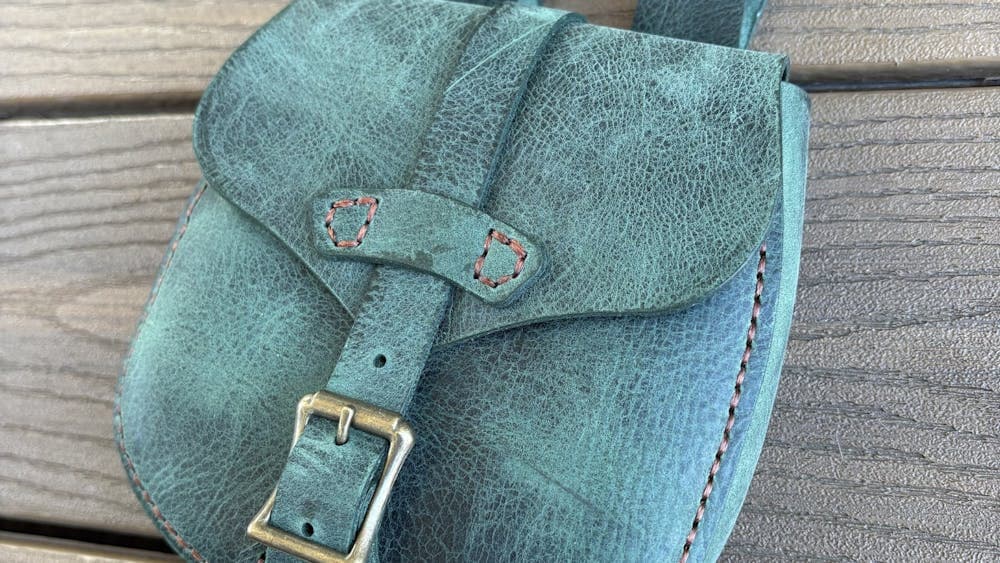 Grey buckled leather pouch