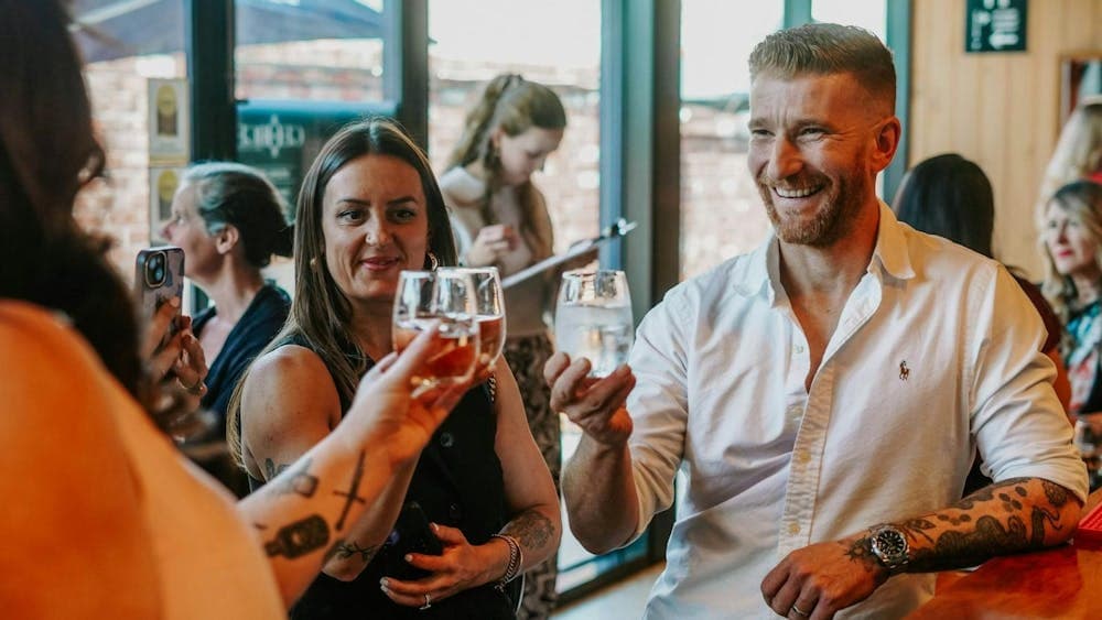 People drinking wine and having a fantastic time