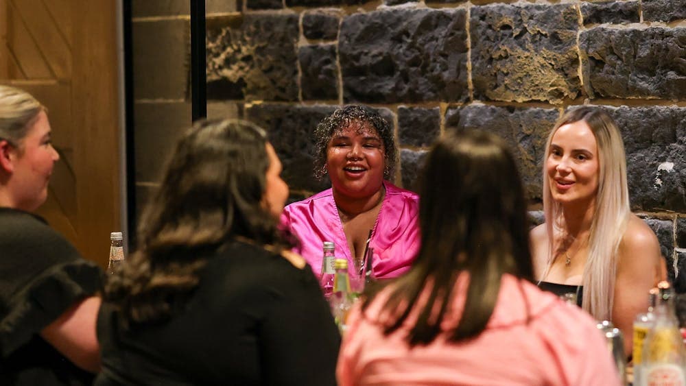 group of women seated at a table at Itinerant Spirits cocktail making class