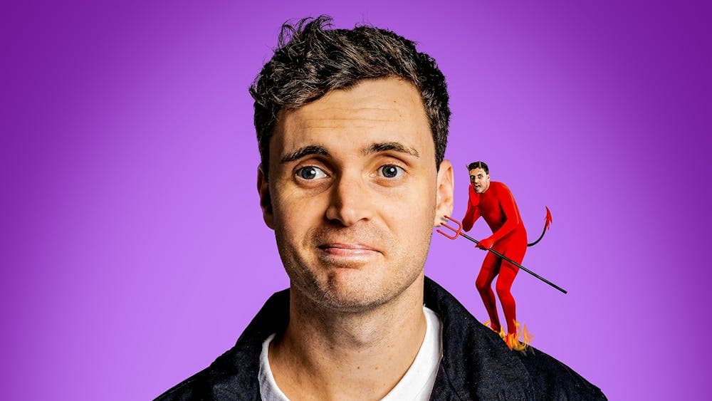 Luke Kidgell with a little version of himself dressed as a devil on his shoulder