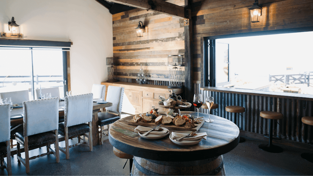 Grazingboard on barrell with wine & dining table