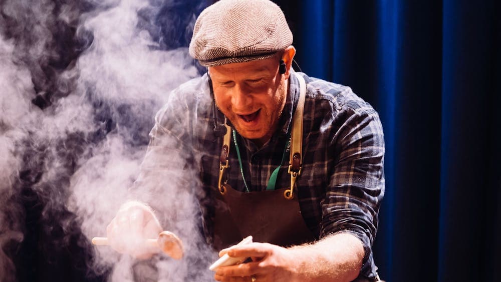 Tim Bone cooking on a stage