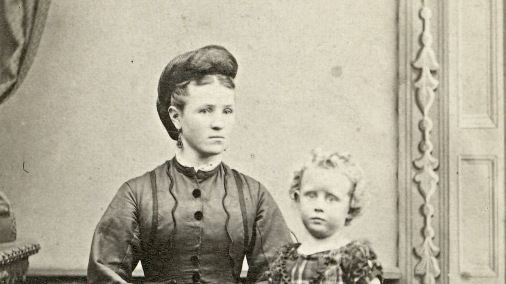 ‘Studio portrait of woman and young girl