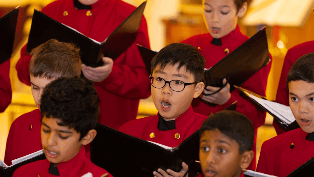 Members of the Australian Boys Choir sing during a performance