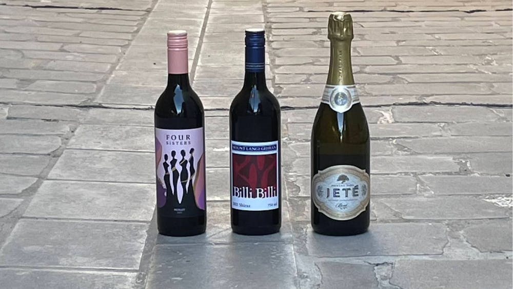 Wine Three wine bottles on the ground