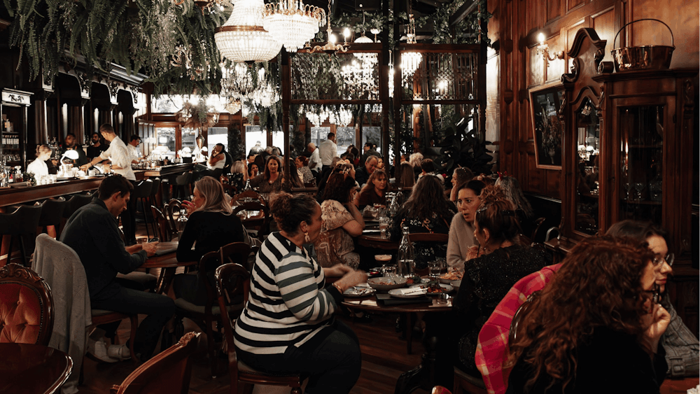 people sitting at table inside Grainery Lane