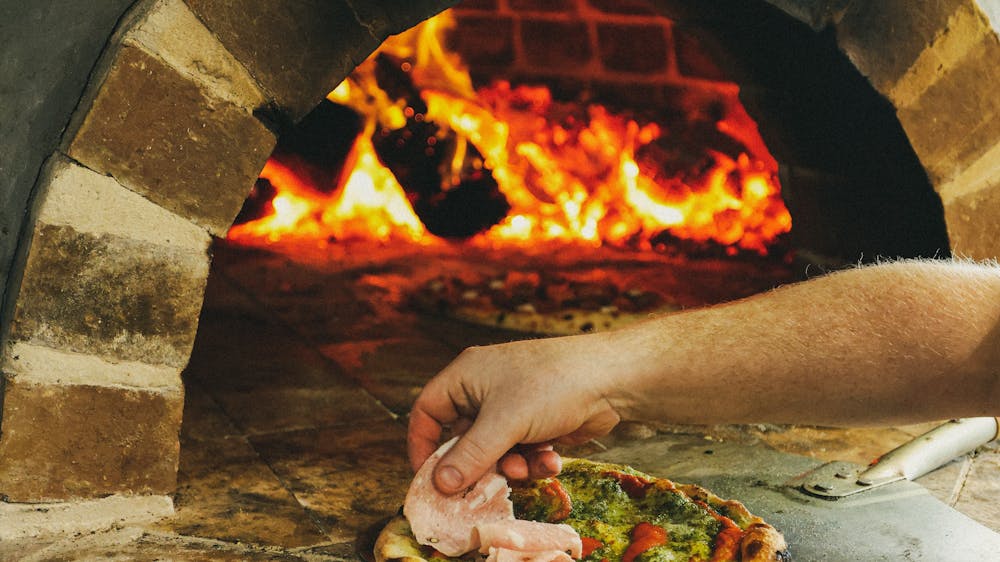 Pizza cooking in oven