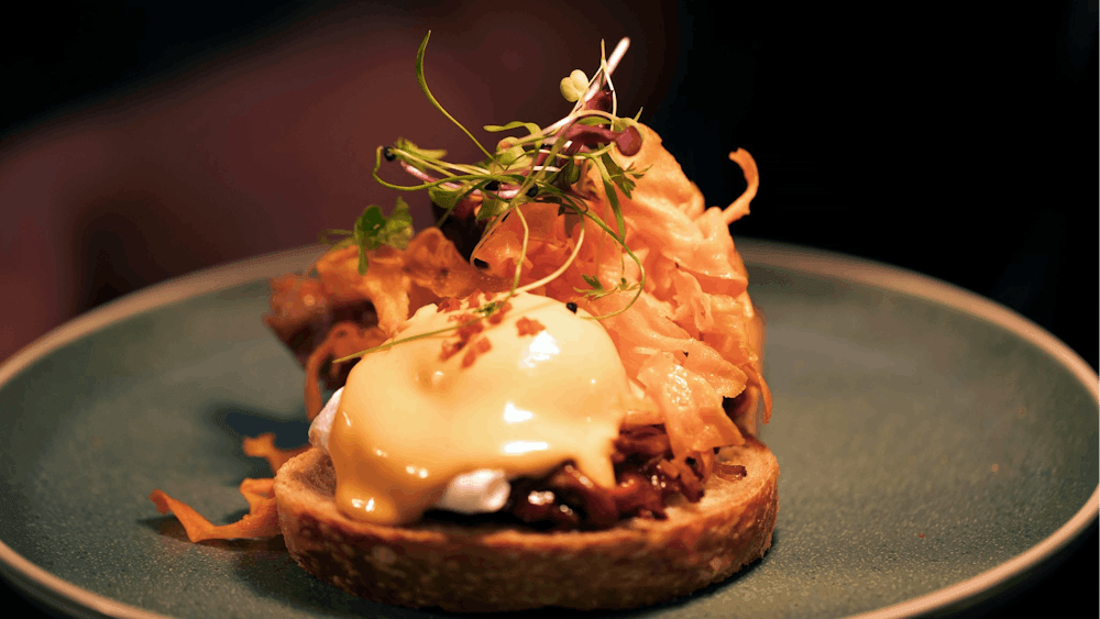 Slow Cooked Pulled Pork, Housemade Chipotle Hollandaise, Crispy Sweet Potato Crisp