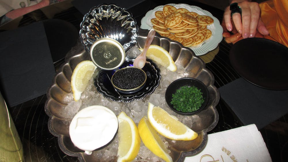 Plate of caviar on table