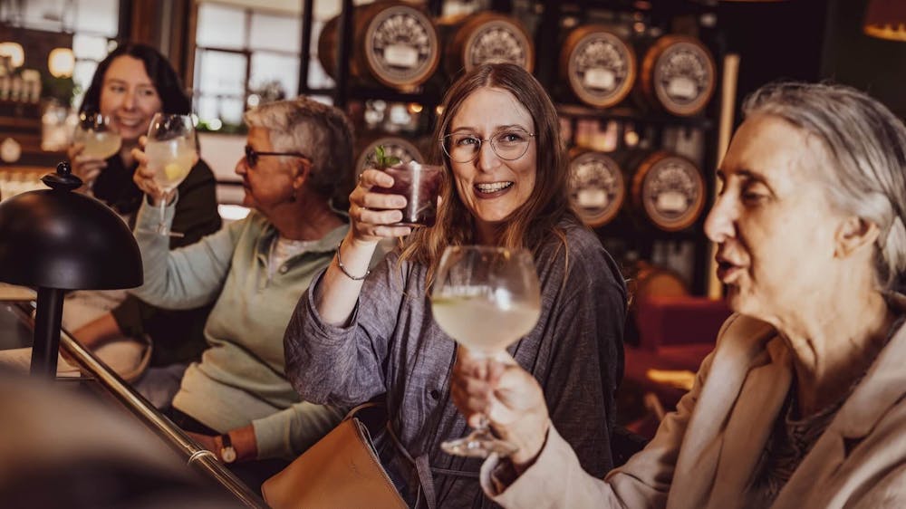 Four women enjoying drinks