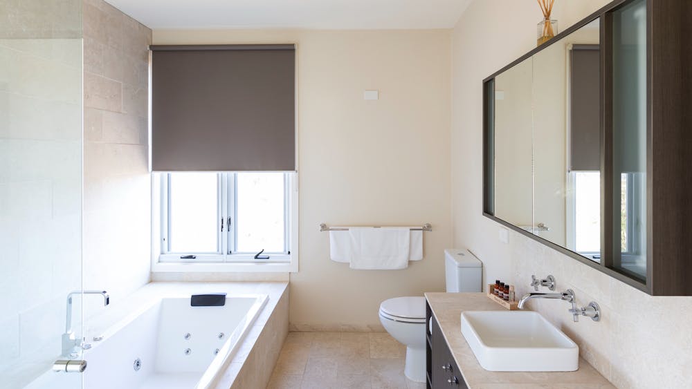 Luxurious bathroom with shower and spa-bath