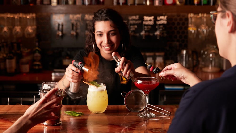 bartender preparing a cocktail at the bar