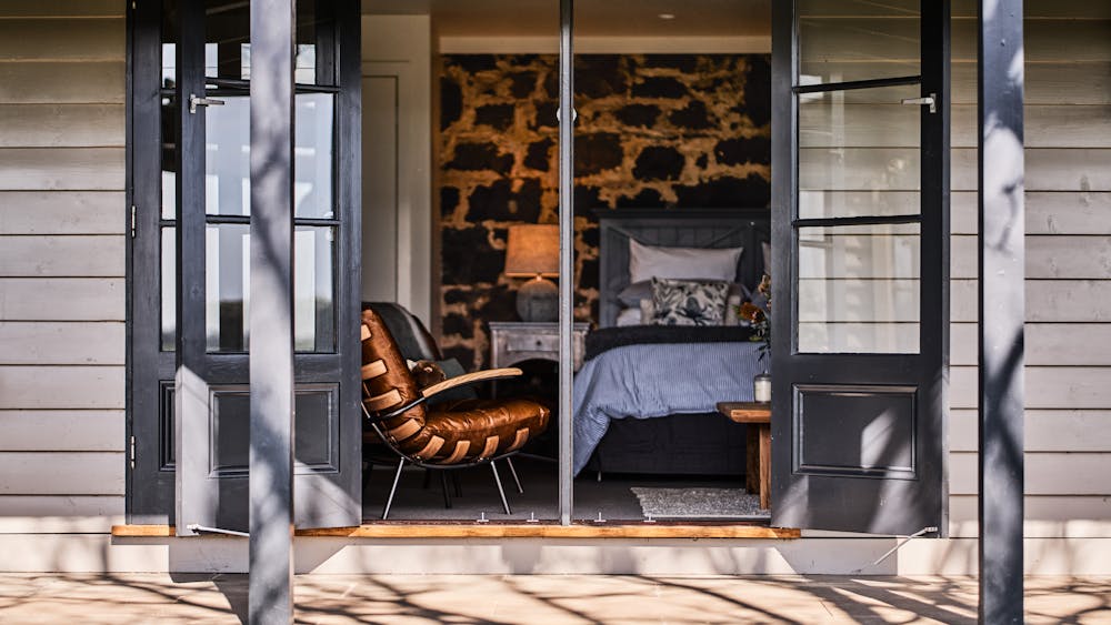 The cabin is a connected be separate part of the house with its own bathroom and kitchenette