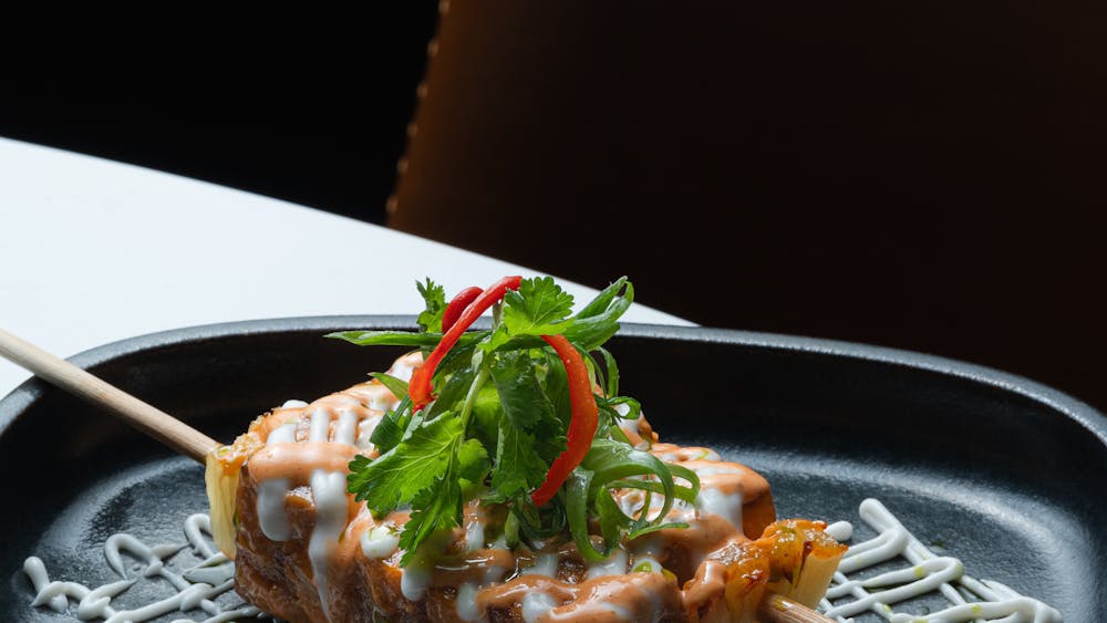 Crispy fried tofu and pineapple skewers topped with a sriracha based bang bang sauce