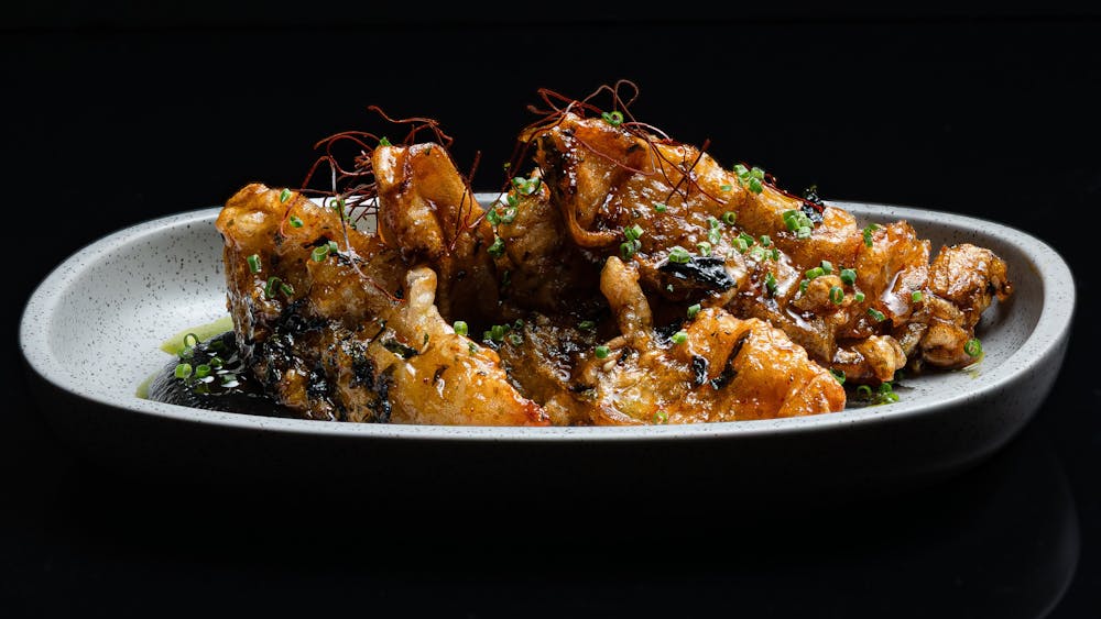 Charred eggplant cooked in a honey soy glaze