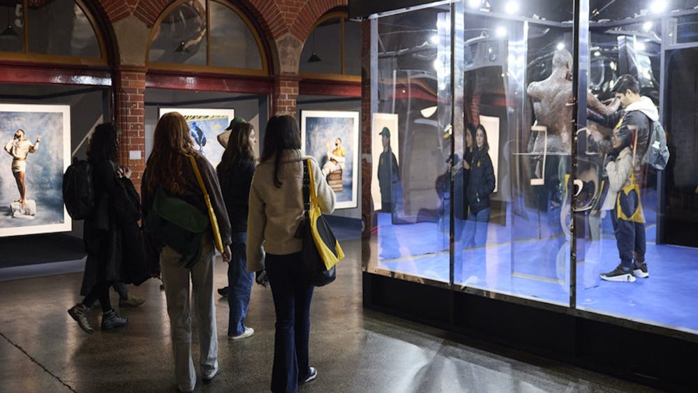People in a photography exhibition inside a heritage building