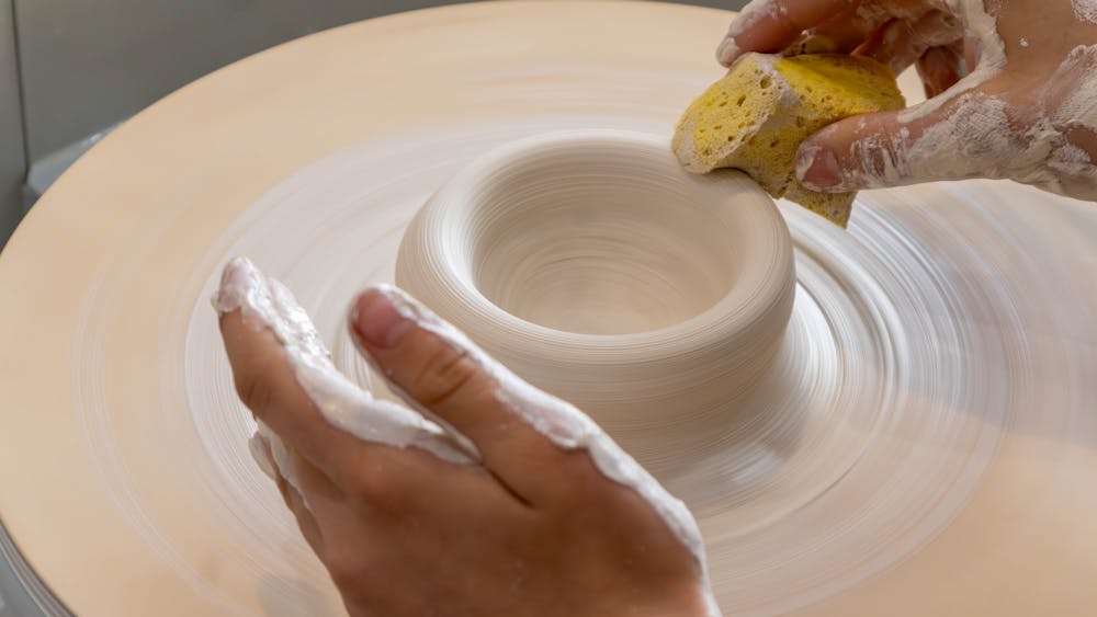 Close up of a pot being made on the potters wheel
