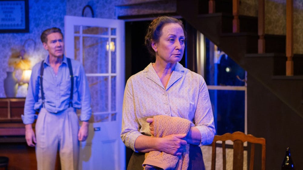 Roo (Ben Prendergast) and Emma (Caroline Lee) in a tense conversation