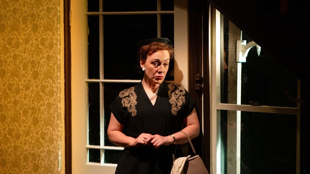 Emily Goddard in a black 1950s dress