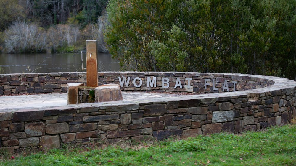 A mineral spring pump next to stonework
