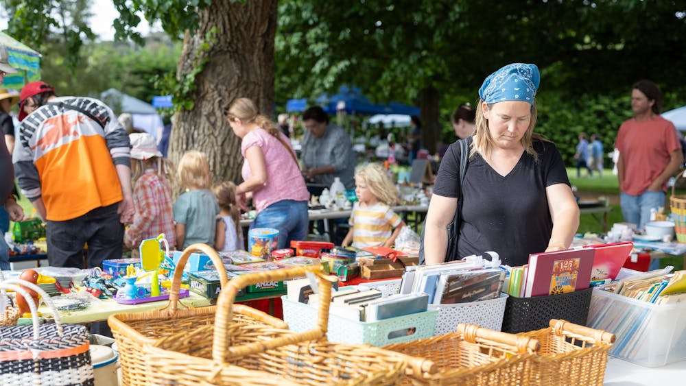People browsing a market stall