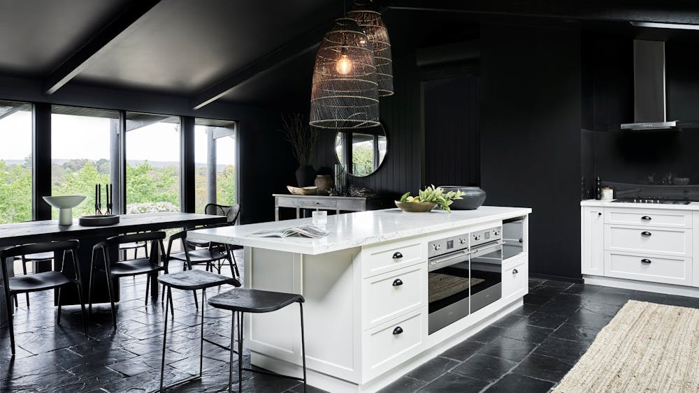 Jumoku Dining with black walls and white furnishings