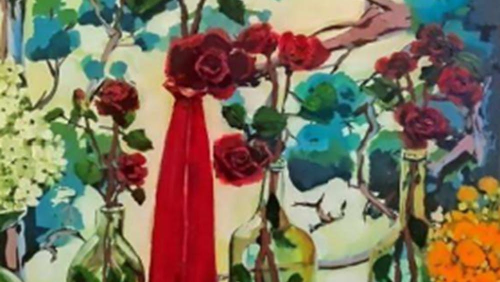 window ledge with colourful floral vases and view to blue trees.